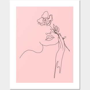 One line drawing of a woman holding a flower Posters and Art